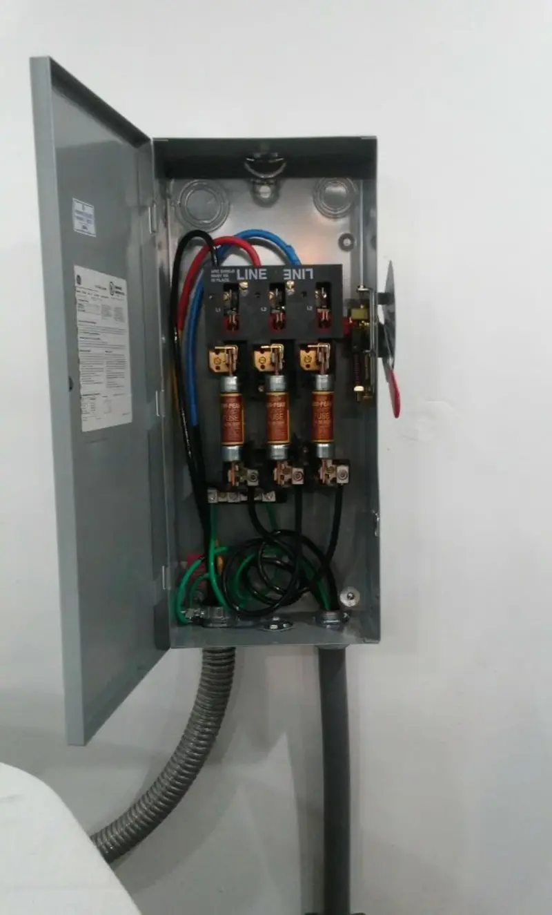 Three-phase disconnect switch installed for Smoke Detector Installation in Economy
